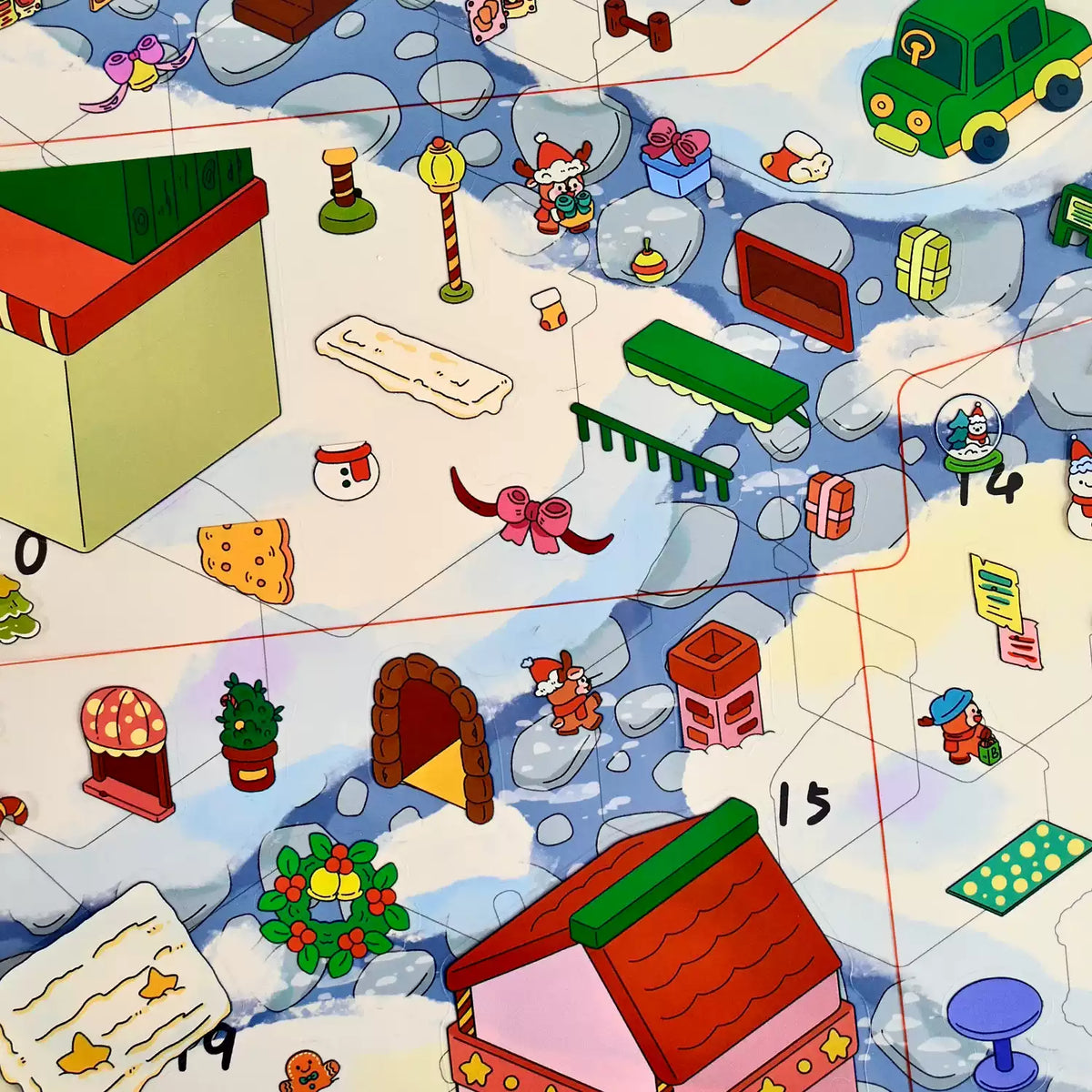 Christmas stickers being placed on the numbered scene card